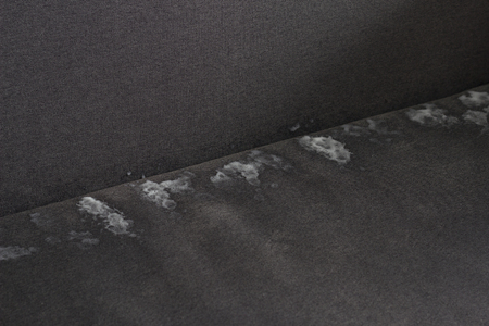 foam for cleaning on the couch, close-upの写真素材