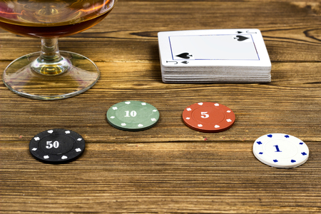 Poker chips card alcohol, wooden background, stackの写真素材