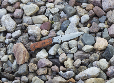 knife in the background of small stones, jackknifeの写真素材