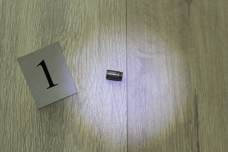 The cartridge case lies on the floor, the murder, the main evidence, a close-up, investigationの写真素材