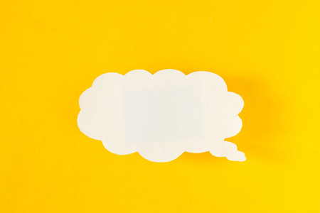 Message in the form of a cloud of paper on a yellow background, social networks, eddyの写真素材