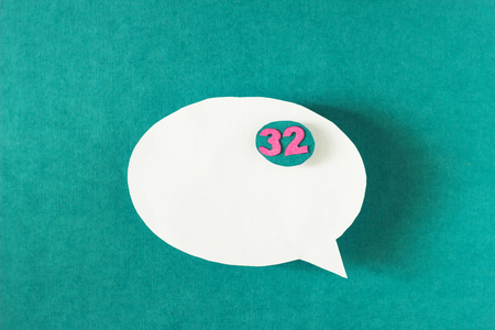 White bubble message from a paper on a turquoise background, social networkの写真素材