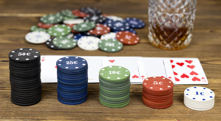 Poker chips card alcohol, wooden background, gamblingの写真素材