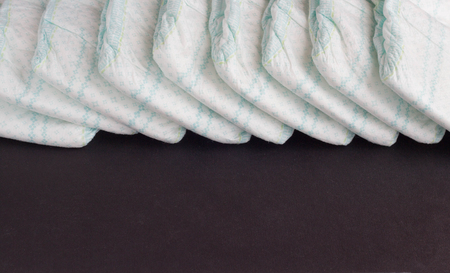 Baby diapers on a black background, diaper, diaperingの写真素材