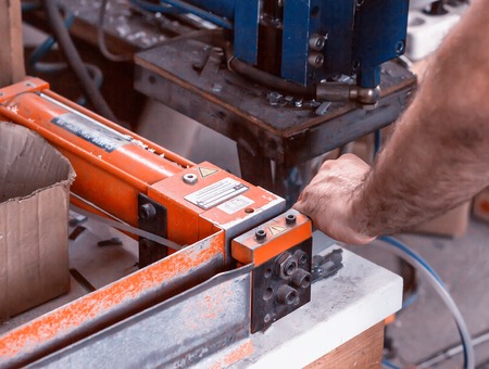 Production of PVC windows, press for biting unnecessary parts, handの写真素材