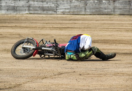 The man fell from a motorcycle and holds on to the abdomen, trauma at a road traffic accidentの写真素材