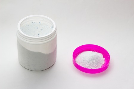 Container with stain remover on a white background, close-up, stain removerの写真素材
