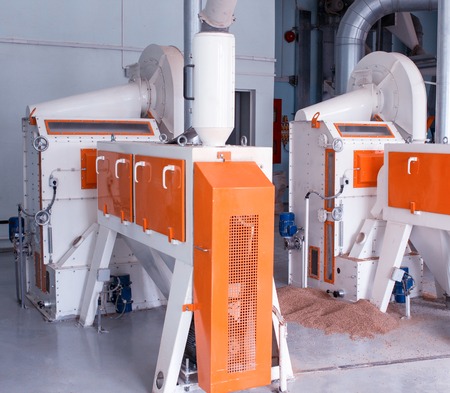 Modern plant for the production of food cereals, a production workshop with equipment for making cereals, the sun, groats, factoryの写真素材