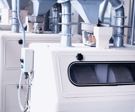 Modern plant for the production of food cereals, a production workshop with equipment for making cereals, the sun, groats, factoryの写真素材