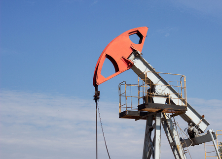 Oil well gas and gasoline well against the blue sky, close-up, Extraction of petroleum, equipment, extraction, environment, oilの写真素材