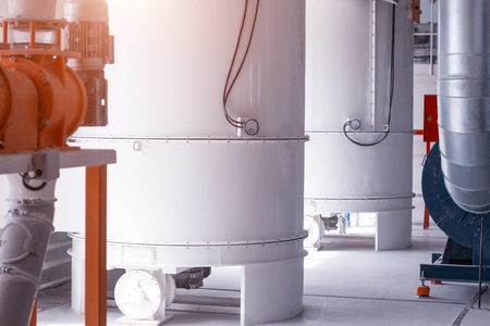 Modern plant for the processing and production of food flour, large tanks in the shop for the storage of food flour and grain, breadstuff, workshopの写真素材