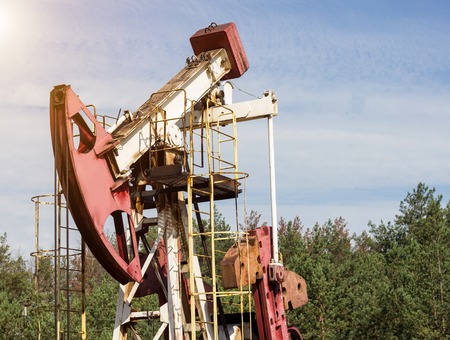Oil well gas and gasoline well against the blue sky, close-up, Extraction of petroleum, equipment, extractionの写真素材