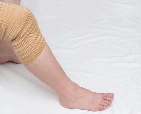 Orthopedic kneecap to relieve the load and fix the sore knee, close-up, copy space, medical, knee-joint, compressionの写真素材