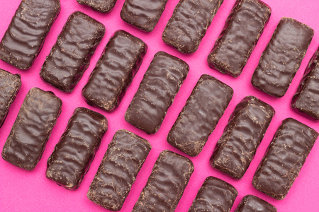 a lot of chocolates on a pink background, the background of chocolatesの写真素材