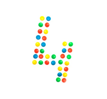 Children's numbers laid out from a multi-colored mosaic figure number 4の写真素材