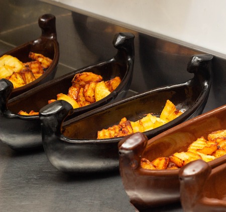 Restaurant dish of boat with fried potatoes in fryer, close-up, shallopの写真素材