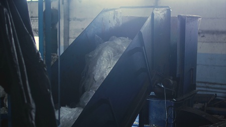 old garbage recycling company, polyethylene bags in conveyor