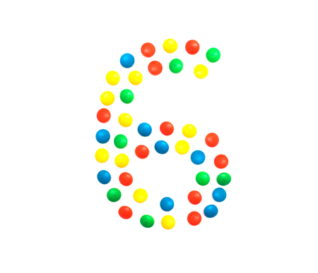 Children's numbers laid out from a multi-colored mosaic figure number 6の写真素材