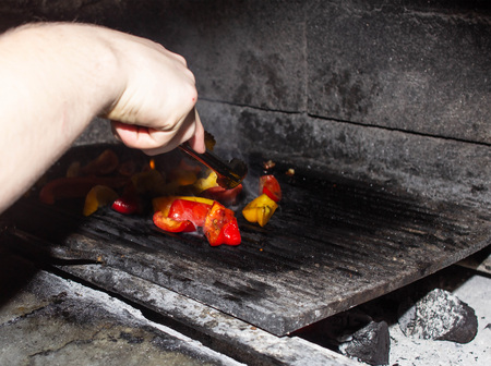 Roasting pickled vegetables in the oven for barbecue, red and yellow peppers in the oven, vegetarian, grill, backgroundの写真素材