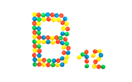 Multi-colored vitamins pills that are lined with the letter Vitamin B12, close-up, medicamentの写真素材