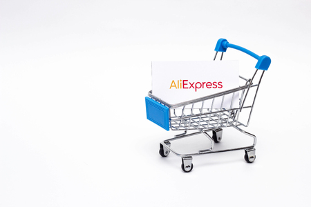 BOBRUISK, BELARUS - JANUARY 30, 2019: Shopping trolley on a white background online store, marketplace Aliexpress, buyerのeditorial素材