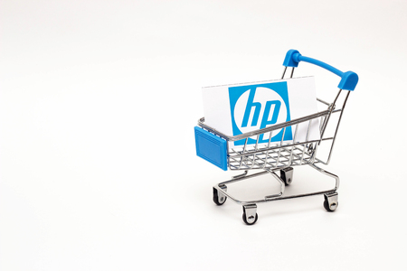 BOBRUISK, BELARUS - JANUARY 30, 2019: Shopping cart on a white background in which the business card of the corporation HP, the brand, copy spaceのeditorial素材