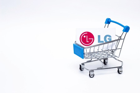 BOBRUISK, BELARUS - JANUARY 30, 2019: Shopping cart on a white background in which the business card of the corporation LG, the brand, technologyのeditorial素材