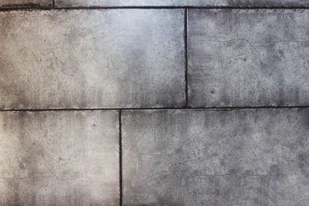 Texture of gray fashionable wall of concrete blocks, close-up, background, toughnessの写真素材