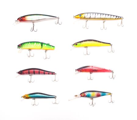 Multicolored lure baubles and wobblers for fishing on a white background, isolate, fishing gear, fishing tackleの写真素材