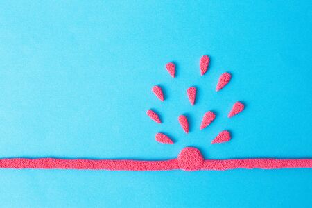 Torn vein on a blue background with blood. The concept of medical diseases. Vein aneurysm, stroke and heart attack, blue background, copy space, thrombosisの写真素材