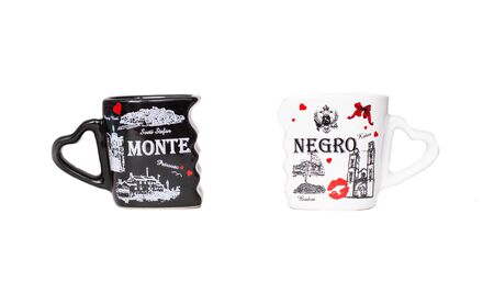 Bobruisk Belarus 2.09.2019: Black and white souvenir coffee cups with the inscription Montenegro, isolate, budvaのeditorial素材