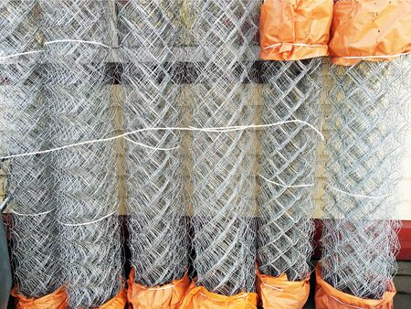 Construction grid a chain-link in rolls. Wicker fence metal bar fence, rabitz, protectionの写真素材