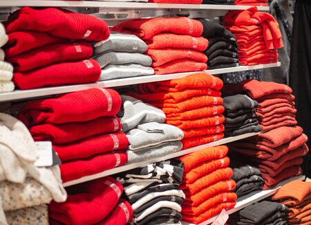 Sale of warm autumn and winter men's and women's fashionable and stylish sweaters. Sweatshirts...