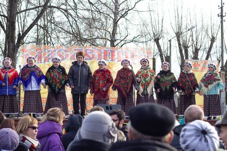 BOBRUISK, BELARUS 10.03.2019: Elderly people sing on stage for a holiday Shrovetideのeditorial素材