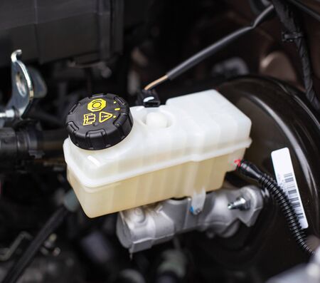 The tank with brake fluid in the car in the engine compartment. The concept of the working brake...
