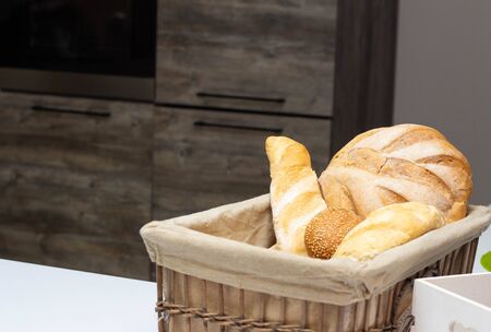 muffin lies in the kitchen in a small basket, loaves, bread and rolls. Bad food, fullness, copy...