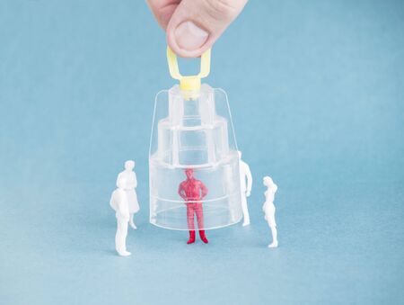 A protective cap is put on a sick person. The concept of quarantine and self-isolation against the...