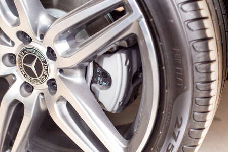 MINSK, BELARUS 21.09.2019: Beautiful modern Mercedes alloy wheel with emblemのeditorial素材