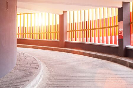 Check-in at the screw parking for cars in the city. Modern parking, sunset, background, construction