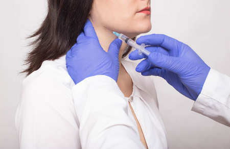 Taking a biopsy from a girl from the salivary gland to check for a benign or malignant tumor,...