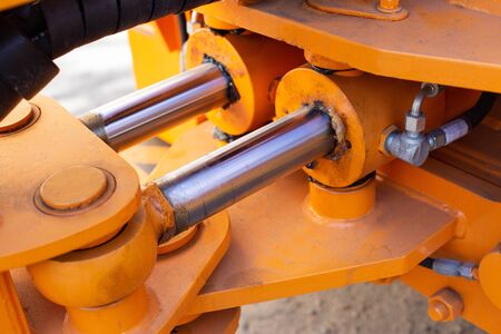 Powerful hydraulic pumps that stand in the bucket of an excavator, industry, close-upの写真素材