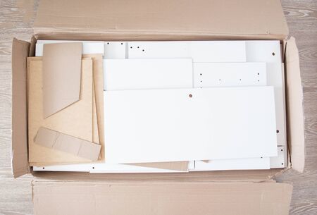 Box with furniture table. Assembly of new furniture, backgroundの写真素材