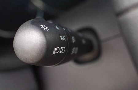 low and high beam switch for headlights and turns in the car, background