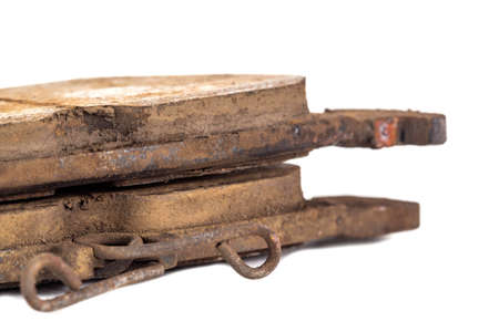 Old worn out brake pads from a car on a white background, isolate, close-up. Quality of friction...