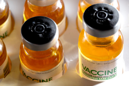 Coronavirus vaccine vials in packaging, macro. Covid treatment and vaccine, SARS-Cov-2