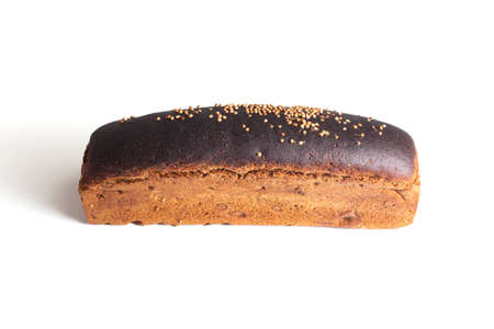Loaf of black wheat bread with coriander seasoning on white plate, isolate