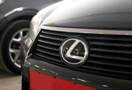 MINSK, BELARUS 07.10.19: Lexus car emblem on the car hood. Concept of brand and quality cars, close-up. Industryのeditorial素材