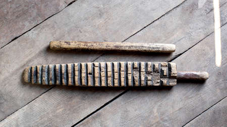 Household item was used for knocking out washing and ironing clothes. The hand-wrung linen was wound on a roller or rolling pin and rolled out with a ruber.の写真素材