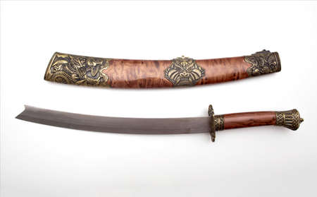 Katana saber with beautiful patterns on a white background, isolate. Close up, history