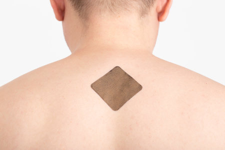 The guy with the anti-tobacco medical plaster on the skin of the body to get rid of the bad habit of...